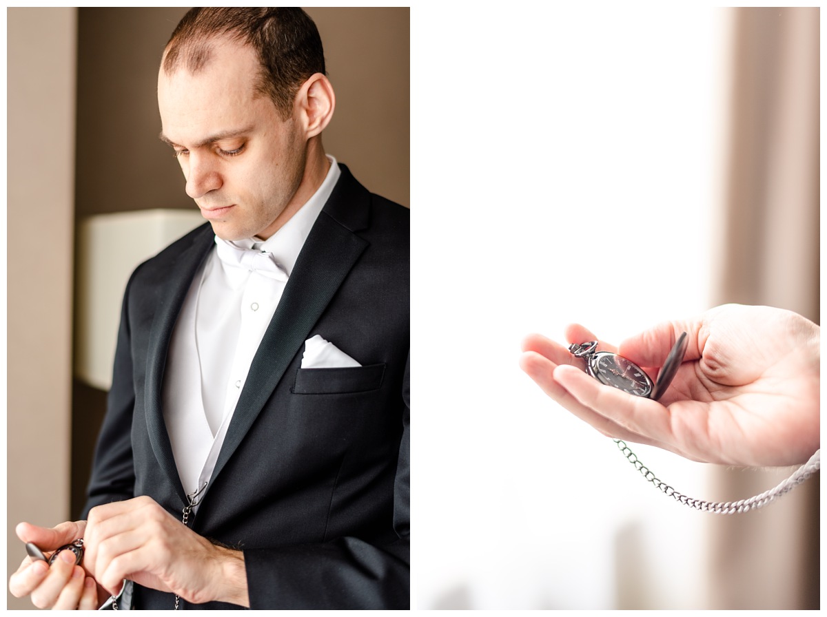 groom looking at his pocket watch in a suit