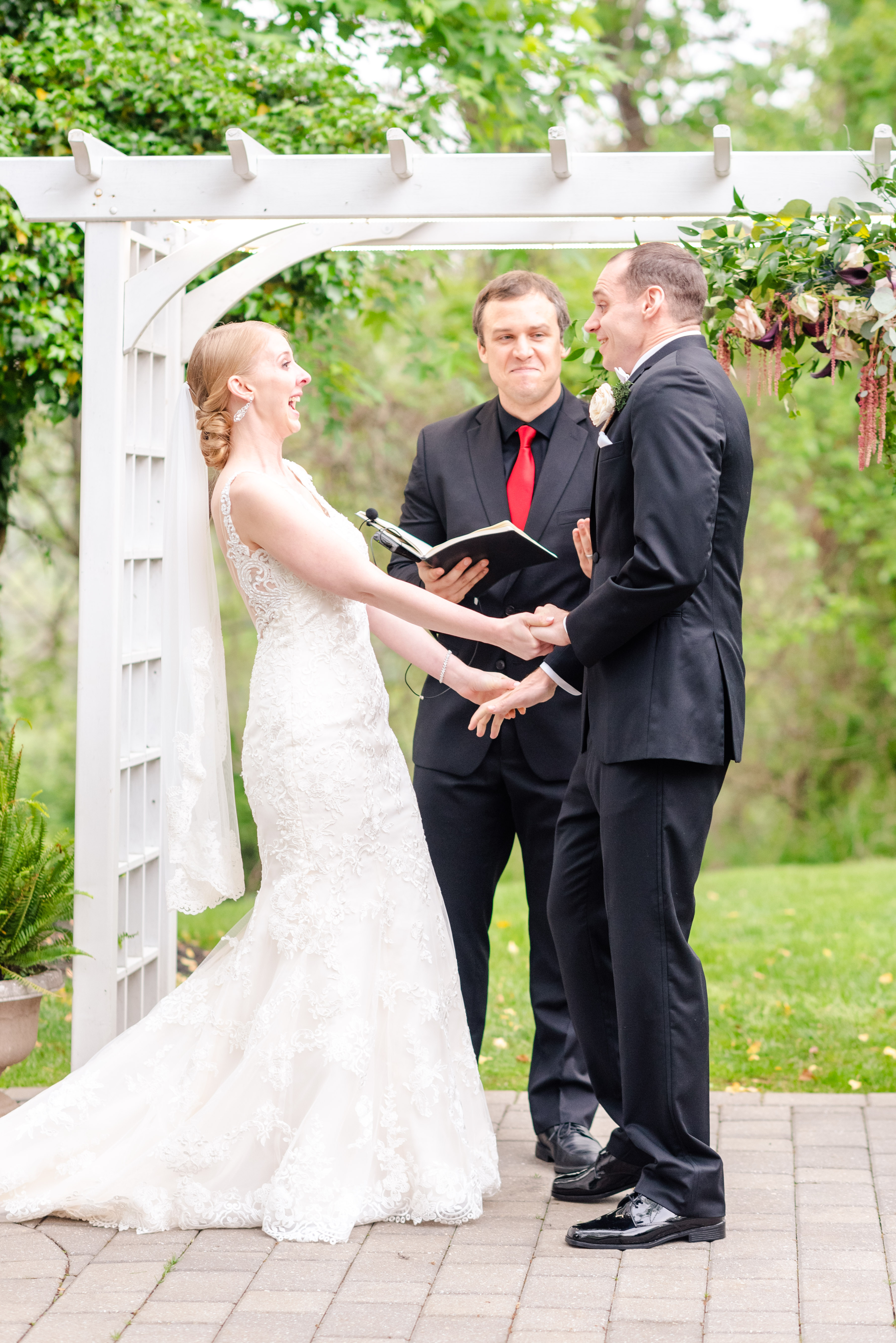 bride and groom at alter excited before first kiss