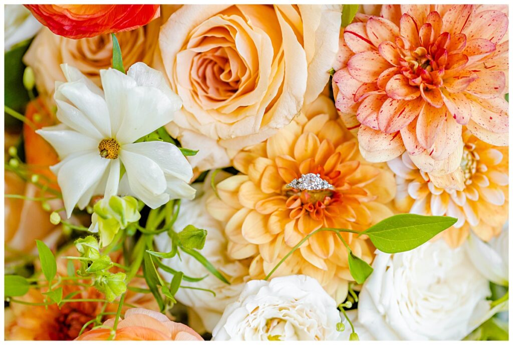 engagement ring in peach orange white and green bouquet
